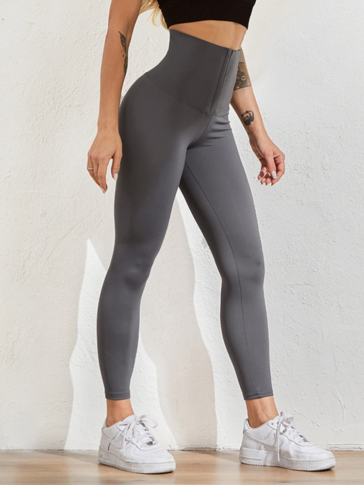 A pair of stylish women body shaper leggings in black, designed to enhance curves and provide comfort.