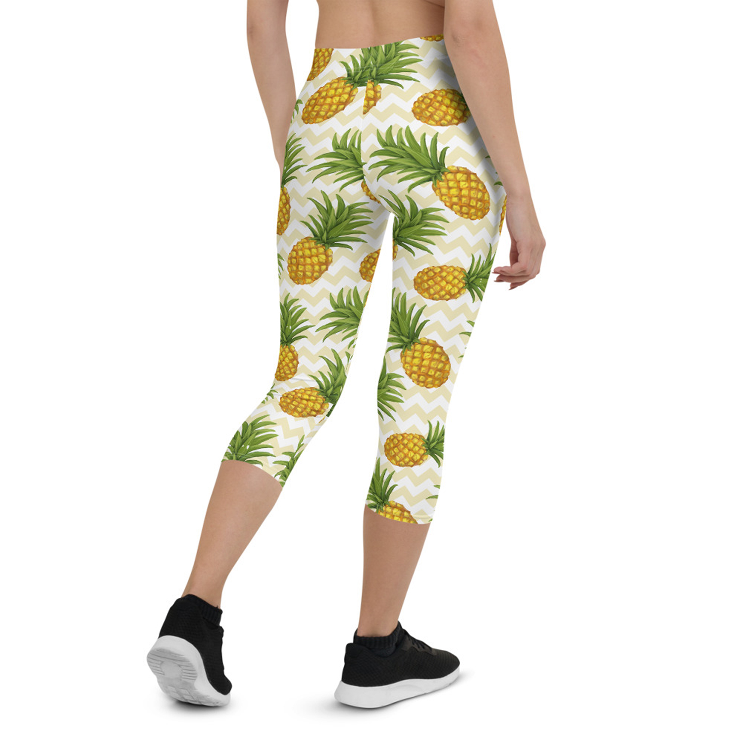 Women Pineapple Capri Leggings featuring vibrant pineapple design, perfect for workouts and casual wear.