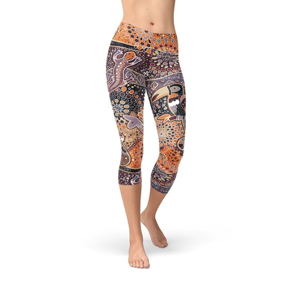 Womens Aboriginal Dreamtime Capri Leggings featuring a vibrant, colorful design inspired by Aboriginal culture, made from high-performance fabric for comfort and style.