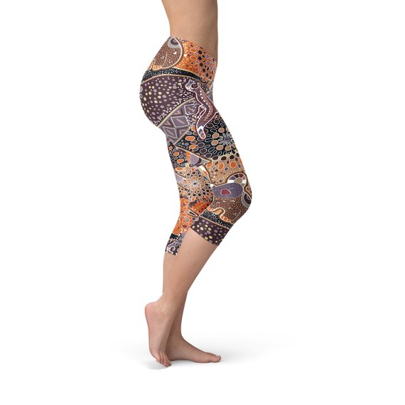 Womens Aboriginal Dreamtime Capri Leggings featuring a vibrant, colorful design inspired by Aboriginal culture, made from high-performance fabric for comfort and style.