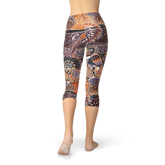 Womens Aboriginal Dreamtime Capri Leggings featuring a vibrant, colorful design inspired by Aboriginal culture, made from high-performance fabric for comfort and style.