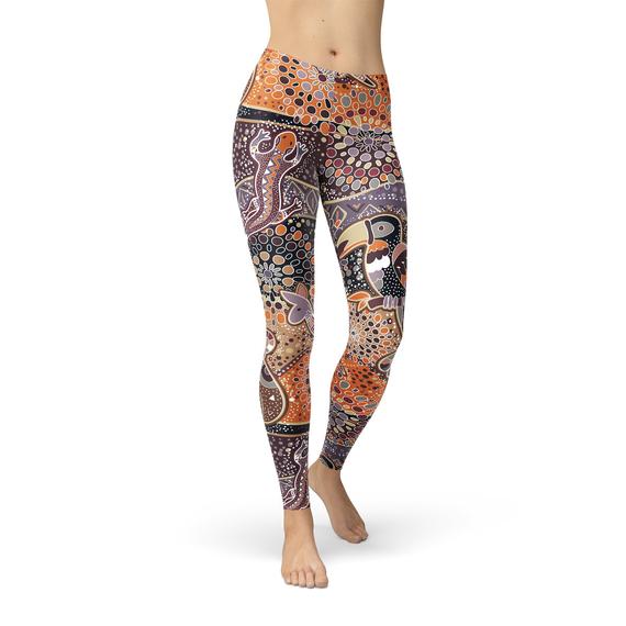 Womens Aboriginal Dreamtime Leggings featuring vibrant Aboriginal art design, crafted from high-performance fabric blend for comfort and style.