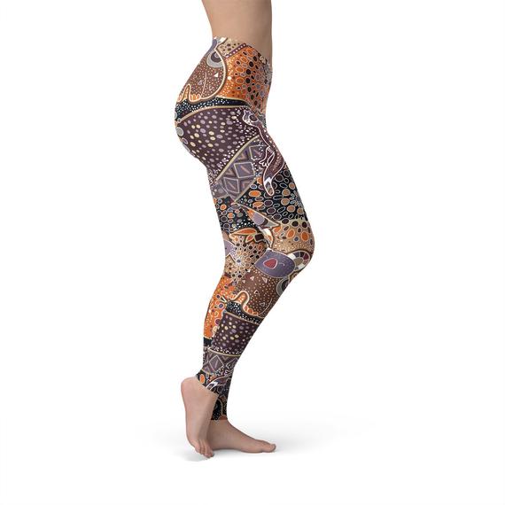 Womens Aboriginal Dreamtime Leggings featuring vibrant Aboriginal art design, crafted from high-performance fabric blend for comfort and style.