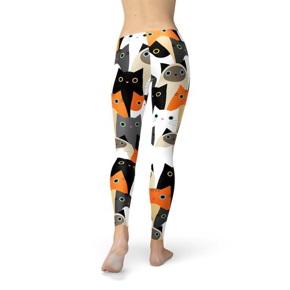 Women's leggings featuring a vibrant all-over cat print design, made from a comfortable and stretchy fabric blend, ideal for workouts and casual wear.