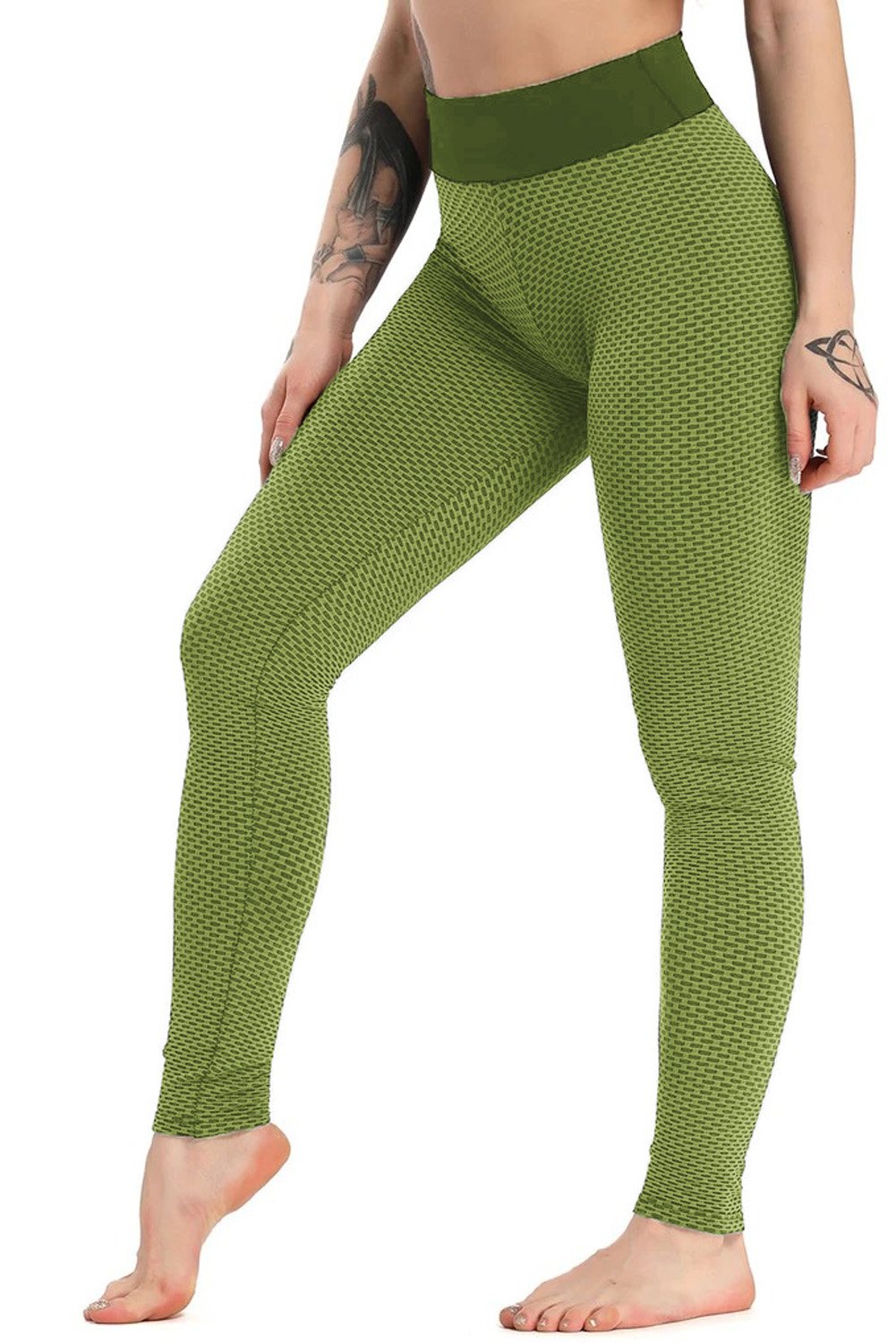 Women's army green high waisted butt lifting yoga gym leggings displayed on a flat surface, showcasing their stretchy fabric and flattering design.