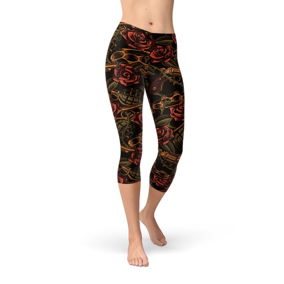 Women's Badass Capri Leggings featuring unique graphic designs, made from high-performance fabric blend for comfort and flexibility.