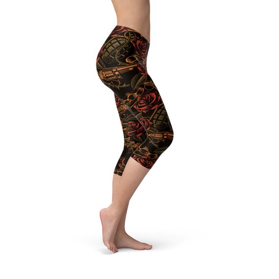 Women's Badass Capri Leggings featuring unique graphic designs, made from high-performance fabric blend for comfort and flexibility.