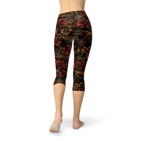 Women's Badass Capri Leggings featuring unique graphic designs, made from high-performance fabric blend for comfort and flexibility.