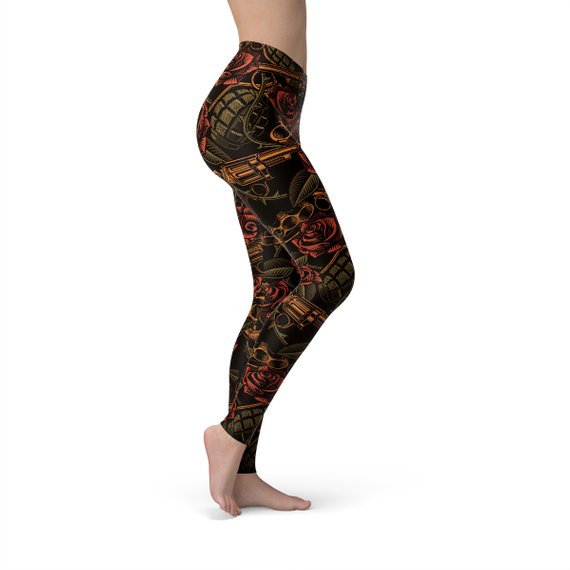 Women's Badass Leggings featuring bold graphic design with revolvers, grenades, and roses, perfect for workouts.