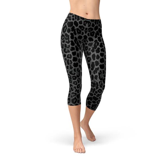 Women's Black Capri Leggings featuring a vibrant leopard spots print, designed for comfort and performance, perfect for workouts and casual wear.