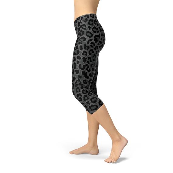 Women's Black Capri Leggings featuring a vibrant leopard spots print, designed for comfort and performance, perfect for workouts and casual wear.