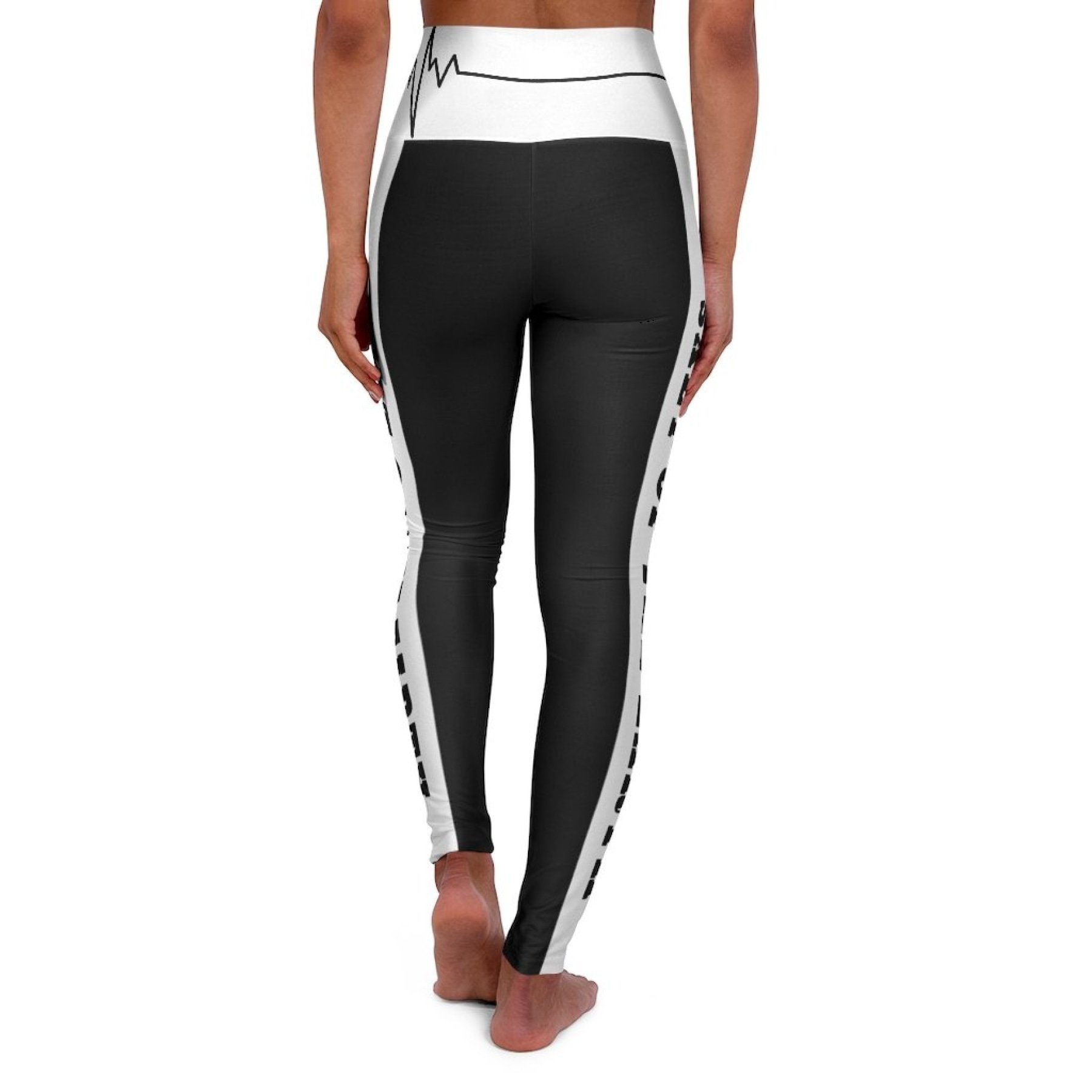 Women's high-waist fitness leggings in black and white, showcasing a flattering design and stretchy fabric, perfect for workouts.