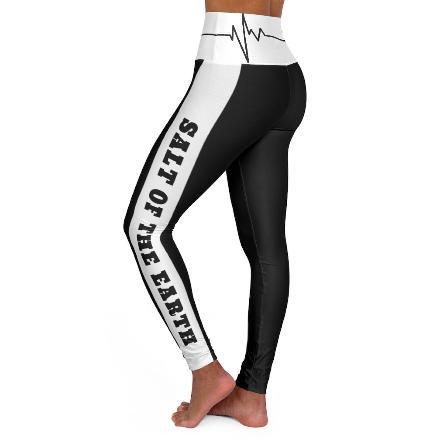 Women's high-waist fitness leggings in black and white, showcasing a flattering design and stretchy fabric, perfect for workouts.