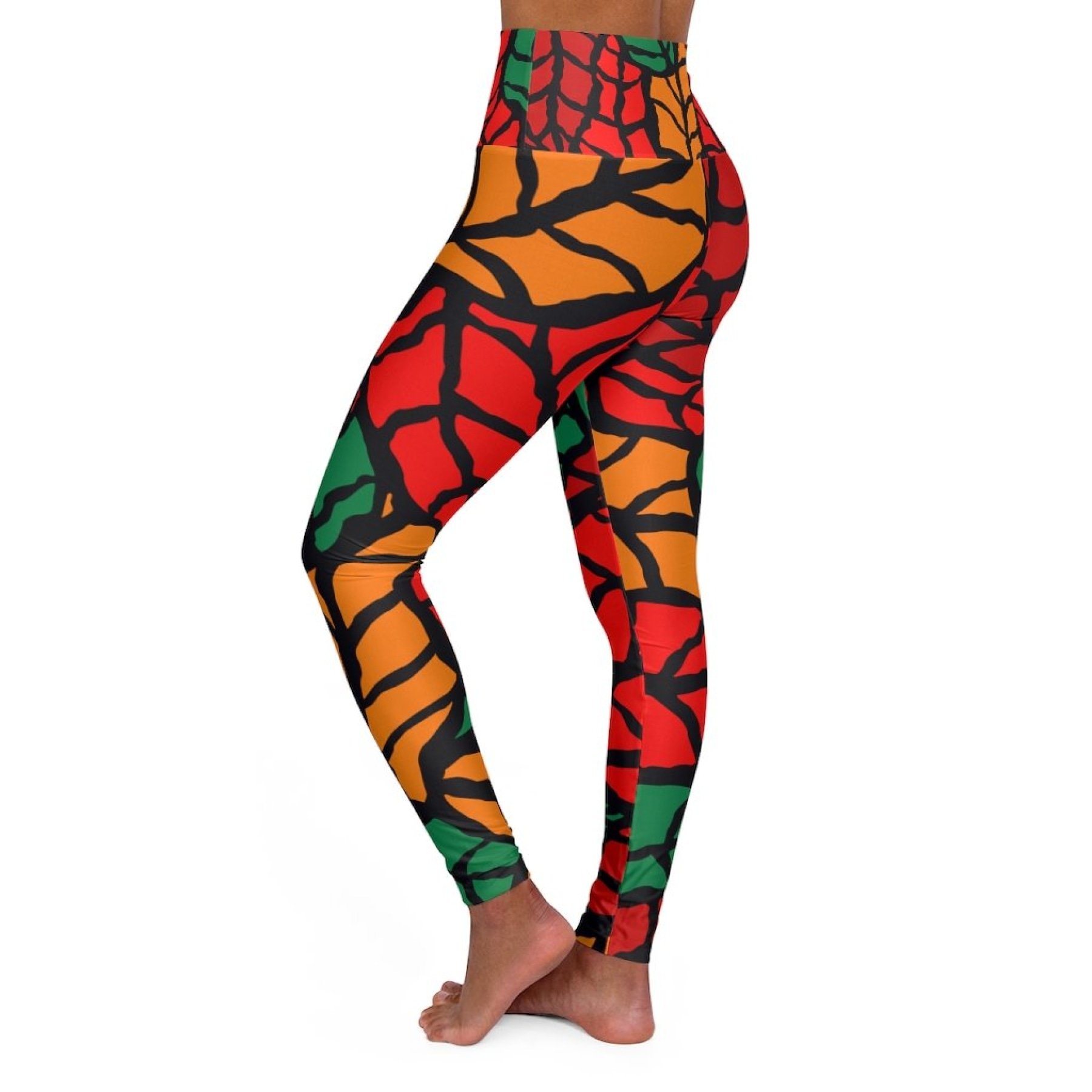 Womens high-waist fitness legging yoga pants in red green autumn leaf design, showcasing a stylish and flattering fit.