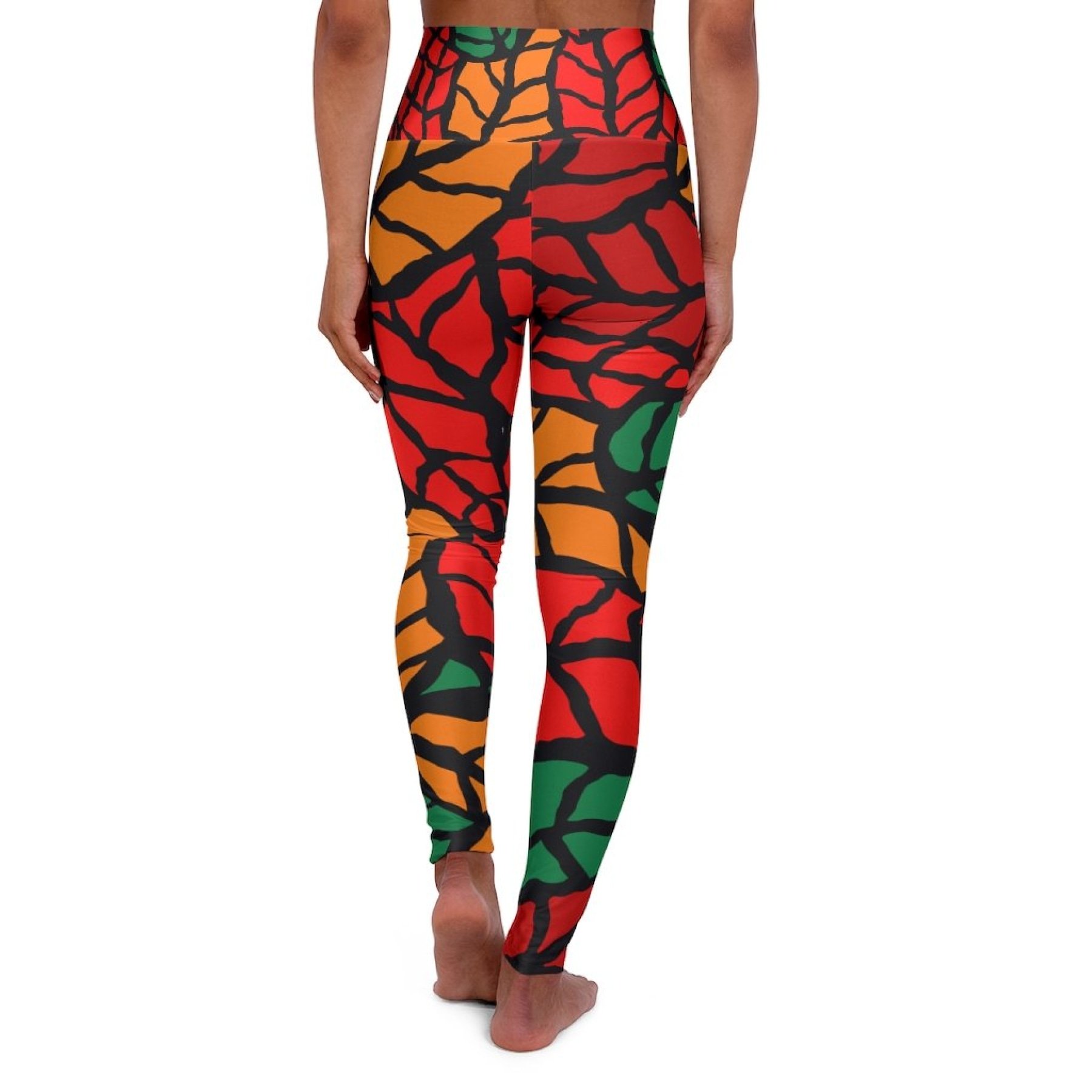 Womens high-waist fitness legging yoga pants in red green autumn leaf design, showcasing a stylish and flattering fit.