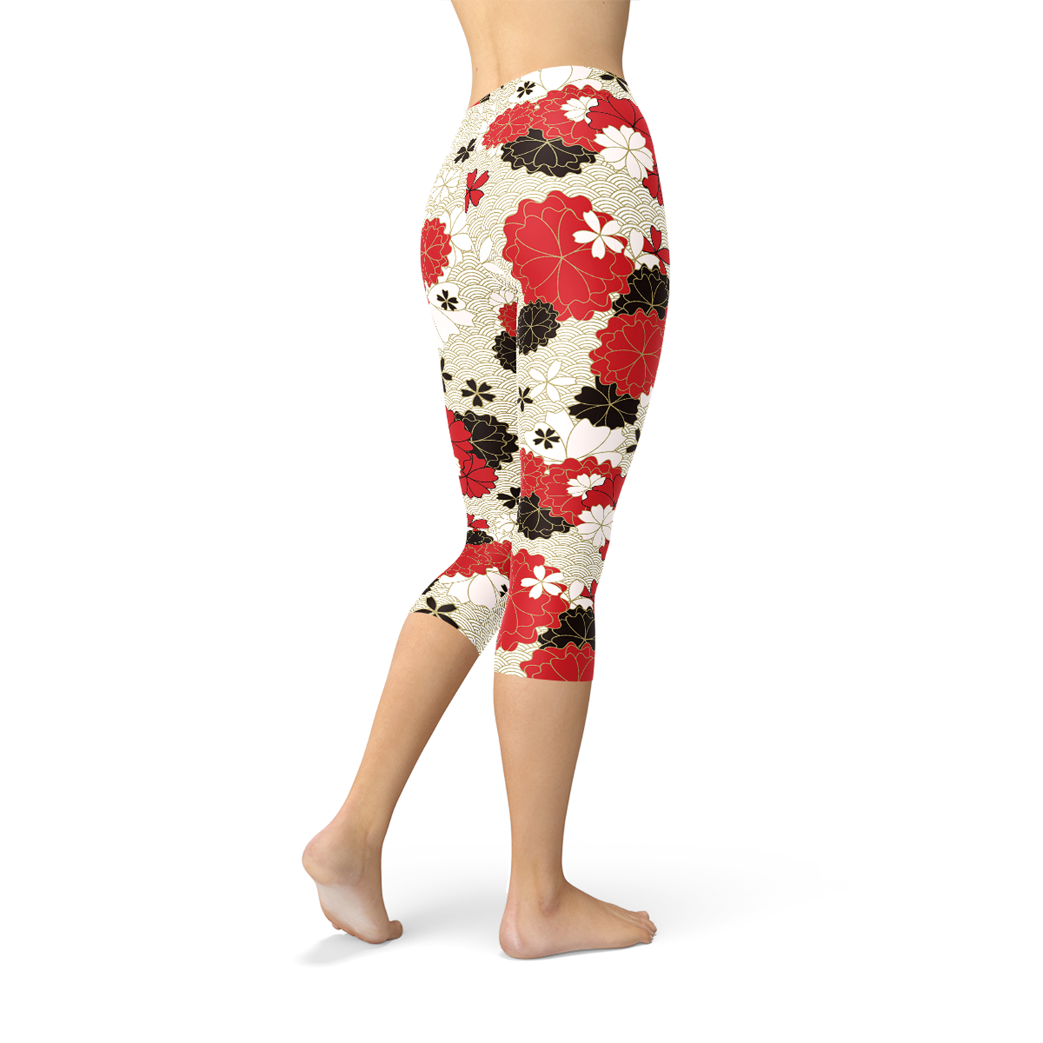 A pair of women's capri leggings featuring a vibrant Japanese cherry blossom print, designed for comfort and performance during workouts.