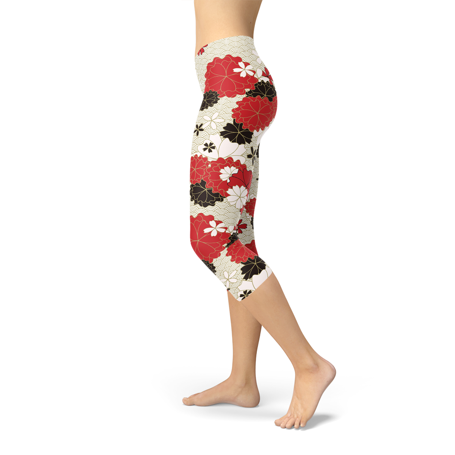 A pair of women's capri leggings featuring a vibrant Japanese cherry blossom print, designed for comfort and performance during workouts.