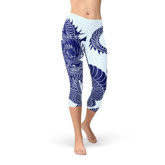 Womens Japanese Dragon Capri Leggings featuring a vibrant dragon tattoo design on a pastel blue scale background, ideal for workouts and casual wear.