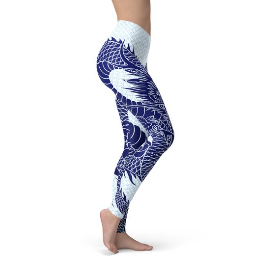 Womens Japanese Dragon Leggings featuring a dragon tattoo design and pastel blue dragon scale background, perfect for workouts and casual wear.