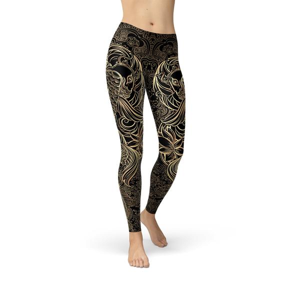 A pair of Womens Koi Fish Black Leggings featuring a vibrant koi fish graphic design, made from a comfortable and stretchy fabric blend.