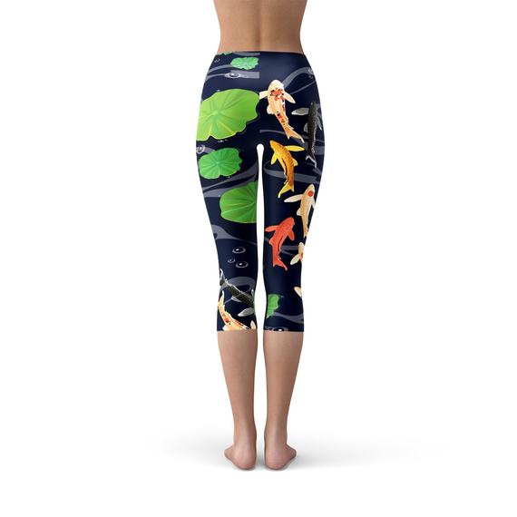 A pair of women's capri leggings featuring a vibrant koi fish design in a serene pond setting, showcasing the unique print and high-quality fabric.