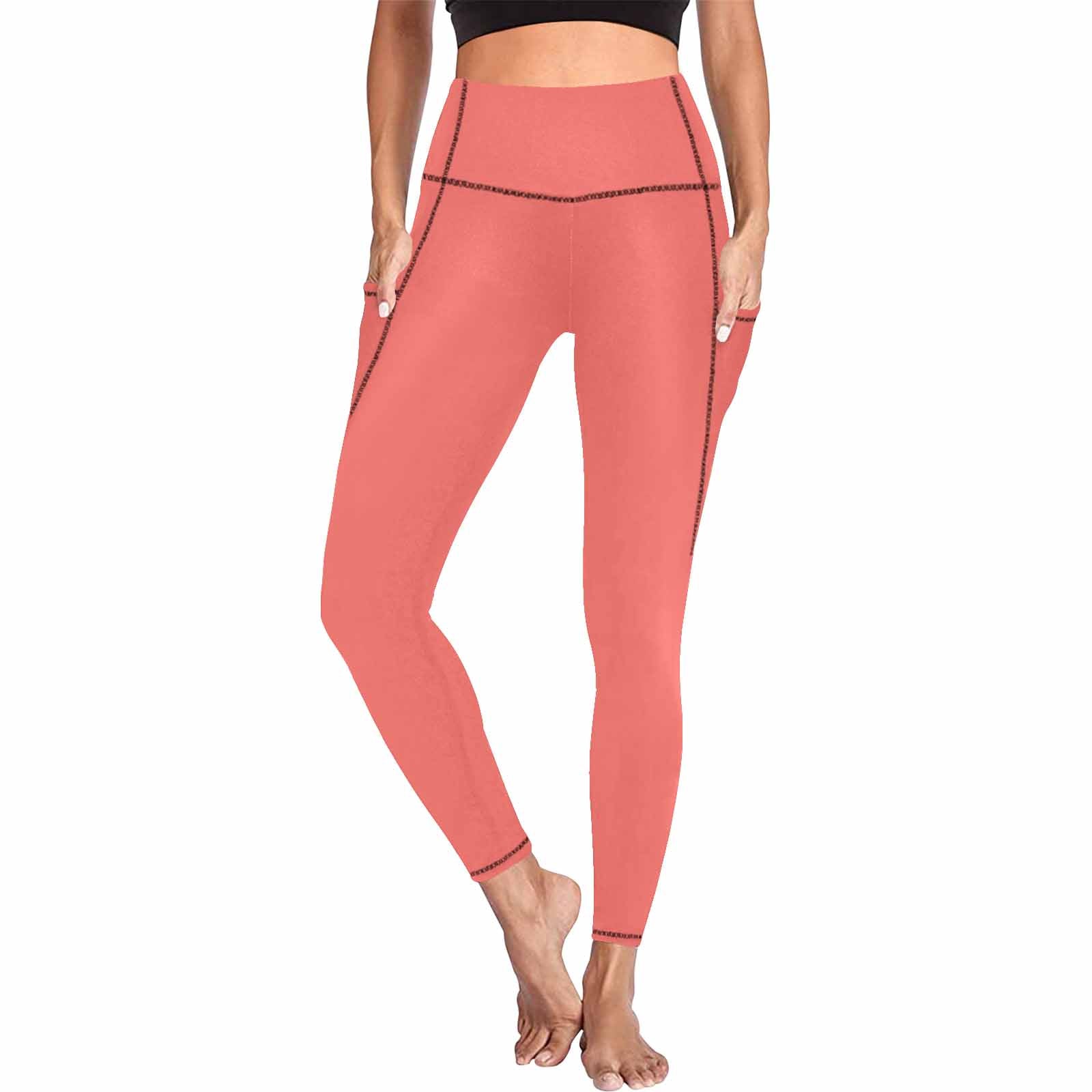 Pastel red women's leggings with side pockets, designed for fitness and comfort.