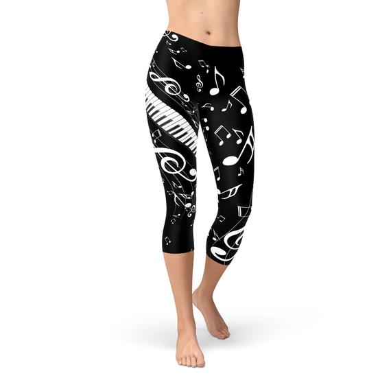 Women's Piano Notes Black Capri Leggings featuring a unique piano notes design, perfect for workouts and casual wear.