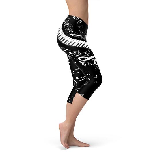 Women's Piano Notes Black Capri Leggings featuring a unique piano notes design, perfect for workouts and casual wear.