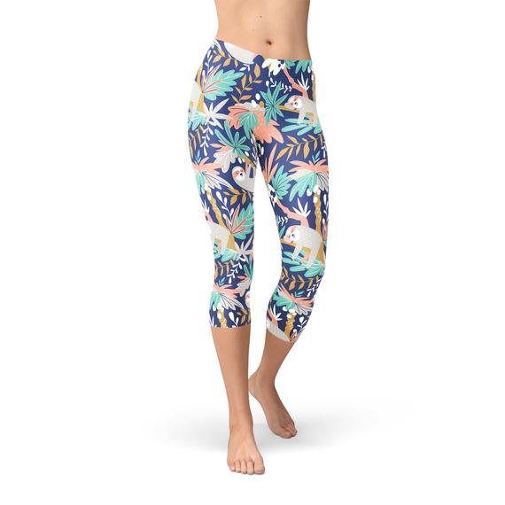 A pair of Women's Sloth Capri Leggings featuring vibrant sloth graphics, designed for comfort and performance, showcasing a four-way stretch fabric.