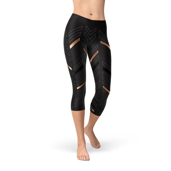 A pair of Women's Sports Stripes Black Capri Leggings featuring a unique graphic design, made from a high-performance fabric blend for comfort and flexibility.