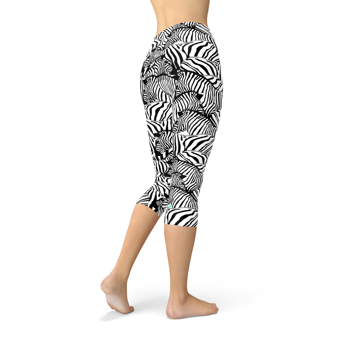 A pair of women's zebra stripe capri leggings featuring a unique design, made from a high-performance fabric blend for comfort and flexibility.