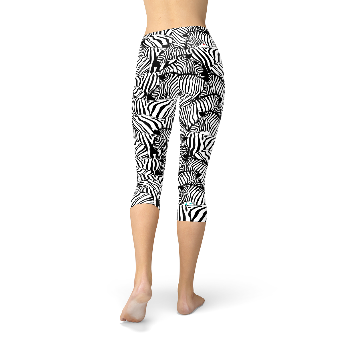 A pair of women's zebra stripe capri leggings featuring a unique design, made from a high-performance fabric blend for comfort and flexibility.