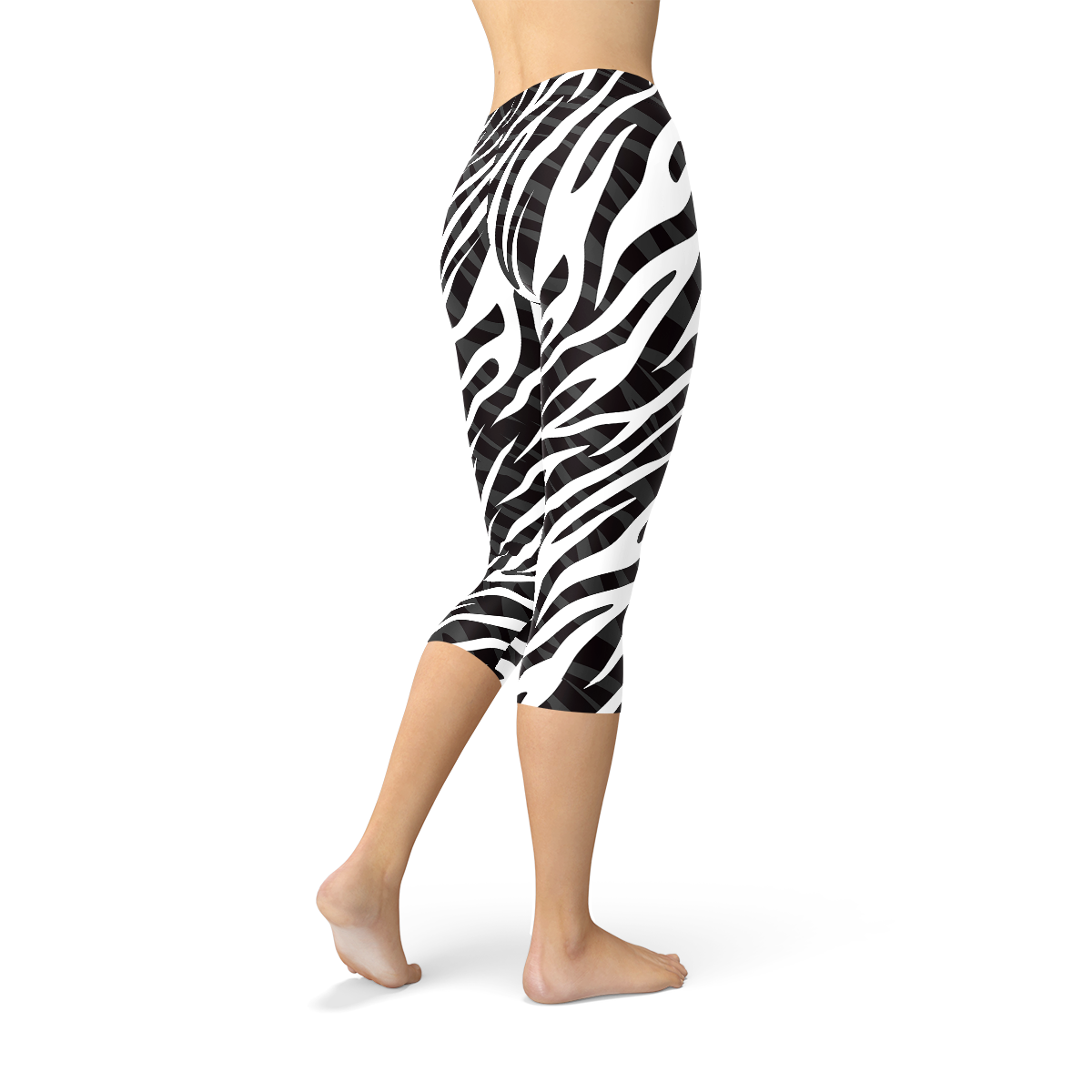 A pair of stylish Womens Zebra Stripes Capri Leggings featuring a bold black and white zebra print design, perfect for workouts and casual wear.