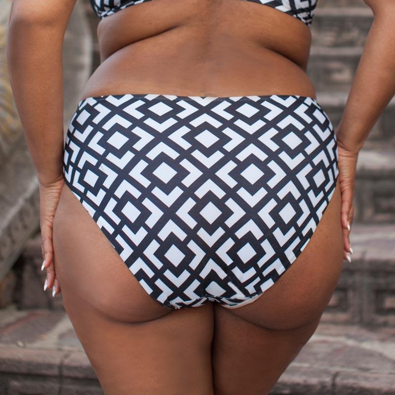 High Waist Bikini Bottom by Lauma Swimwear featuring a geometric pattern, accented waistline, and moderate back coverage in black and white colors.