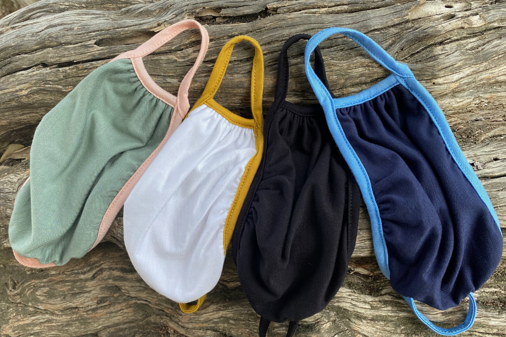 Two Ridiculously Comfy Reusable Cloth Masks in assorted colors, showcasing their soft fabric and stretchy earloops, perfect for everyday wear.