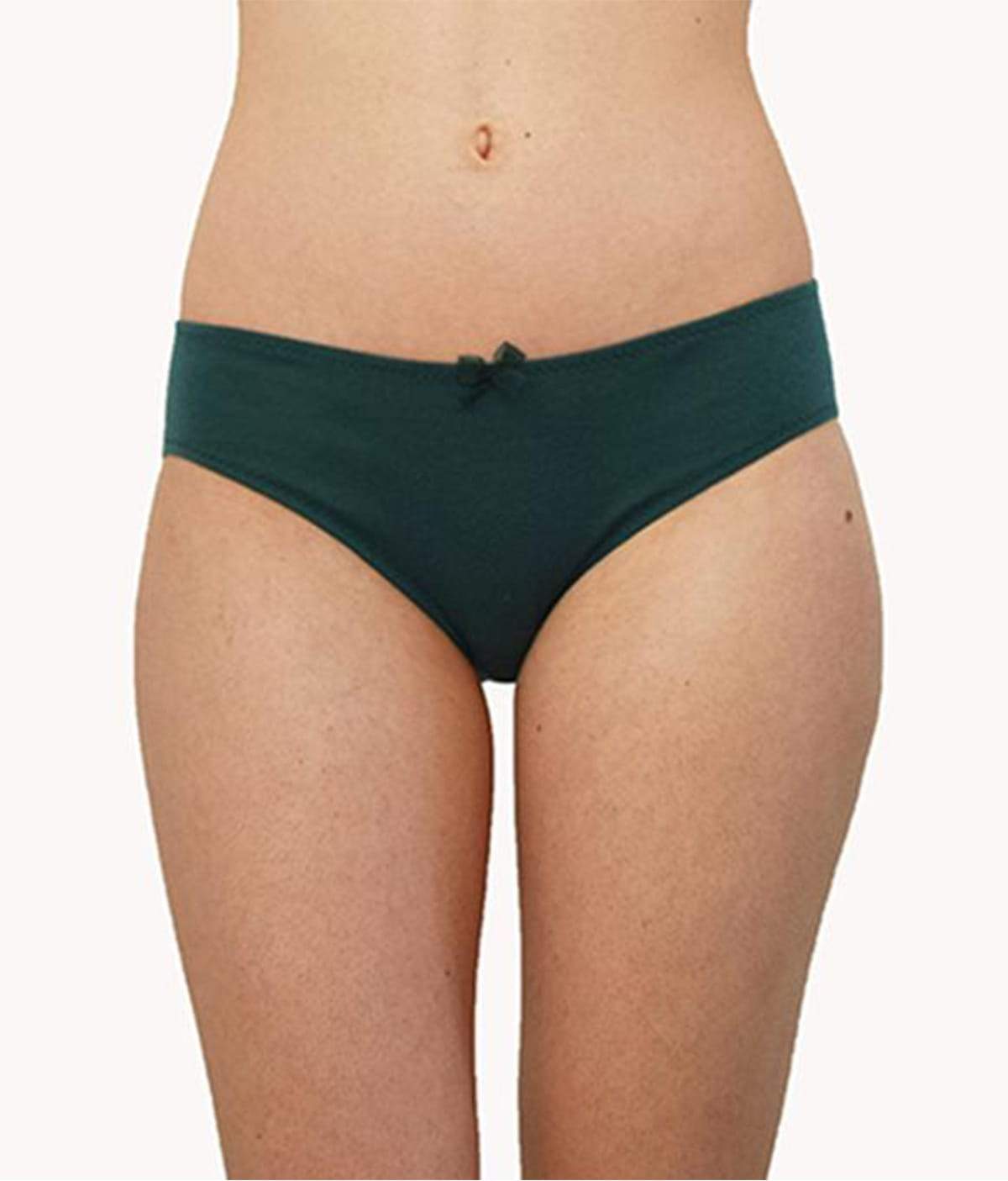 Shorty Amazone underwear made from organic cotton in spruce green with elegant tulle and a delicate bow detail.