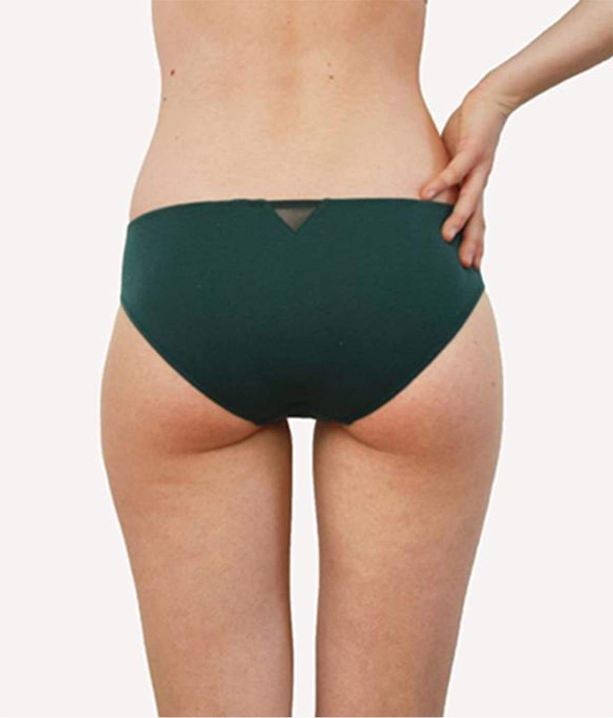 Shorty Amazone underwear made from organic cotton in spruce green with elegant tulle and a delicate bow detail.