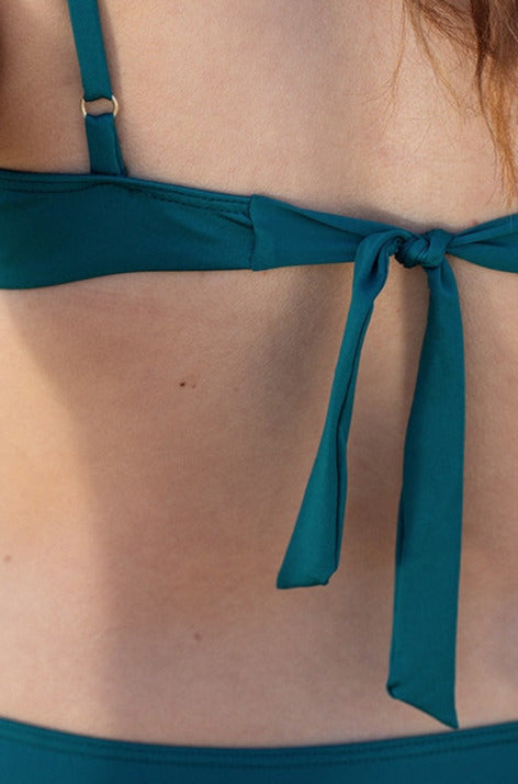 Triangle Kara Aquamarine bikini top featuring a rounded neckline and elegant back knot in a vibrant aquamarine color.