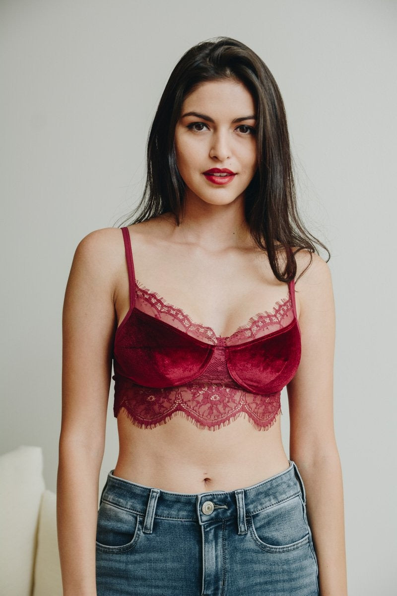 A stylish velvet lace half cami bralette with adjustable straps, featuring sheer lace accents for a chic look.