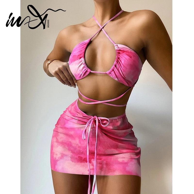 Bandeau bikini set in vibrant pink print, featuring a stylish top and matching bottom, perfect for summer beach outings.