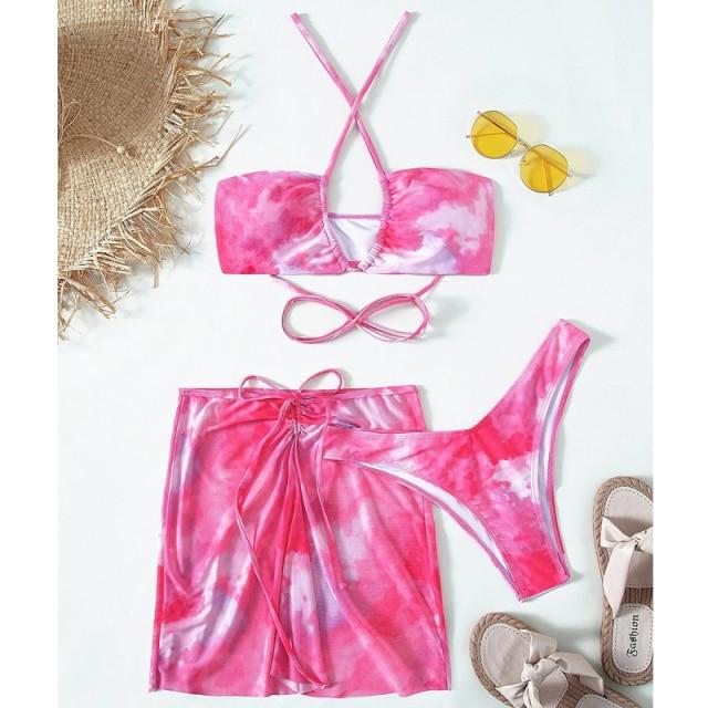 Bandeau bikini set in vibrant pink print, featuring a stylish top and matching bottom, perfect for summer beach outings.