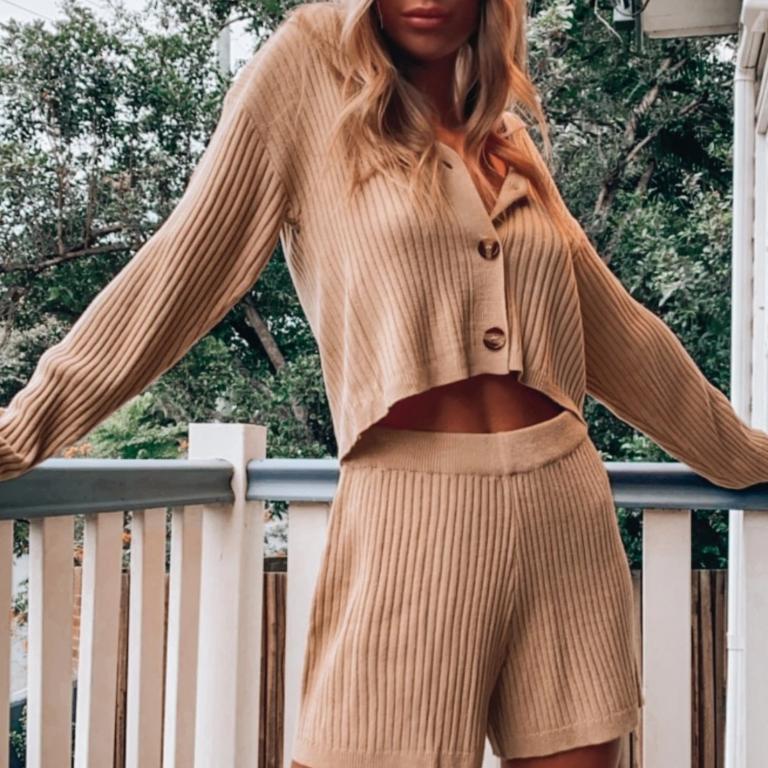 Casual loose solid color women's two piece V-neck set featuring a stylish top with full sleeves and elastic waist shorts, perfect for casual wear.