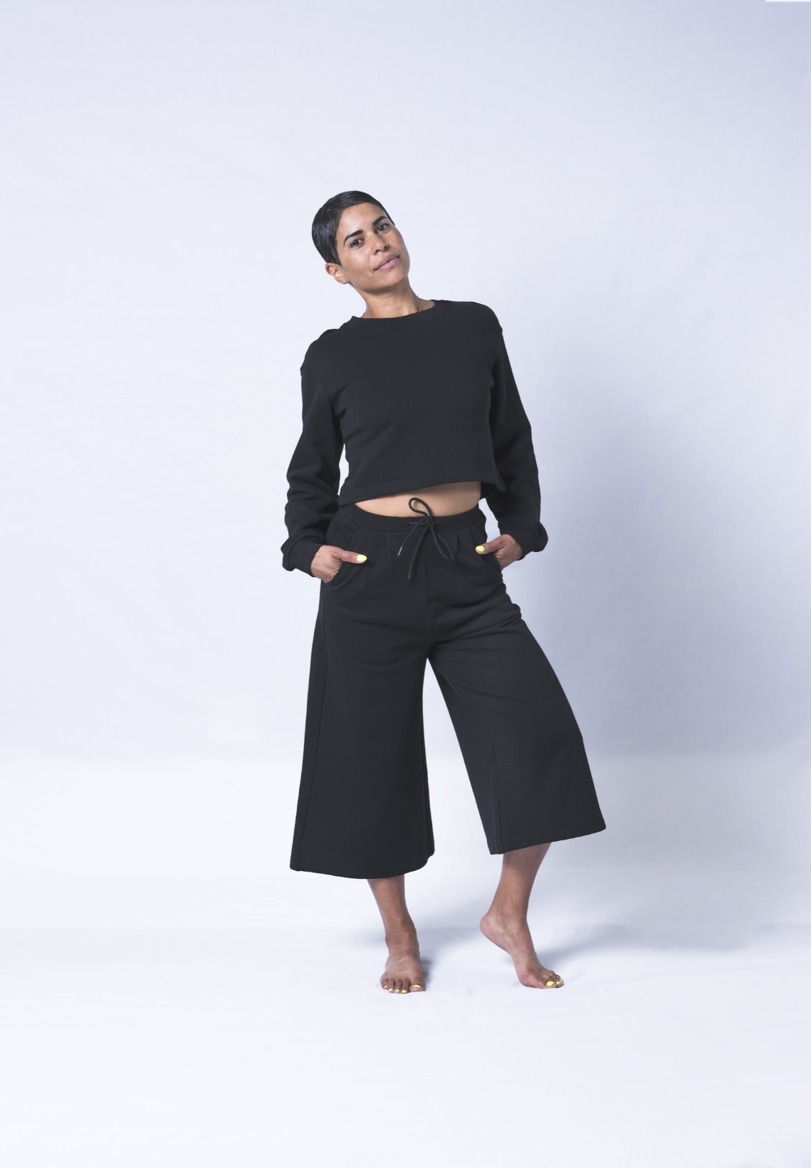 Colette Pants featuring a soft ribbed waistband, deep flat front pockets, and a relaxed fit with a cropped wide leg design, made from heavyweight jersey cotton.