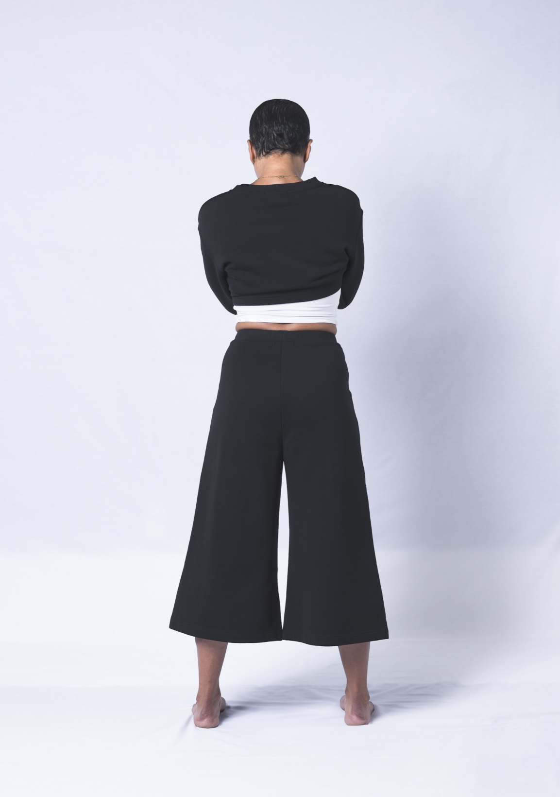 Colette Pants featuring a soft ribbed waistband, deep flat front pockets, and a relaxed fit with a cropped wide leg design, made from heavyweight jersey cotton.