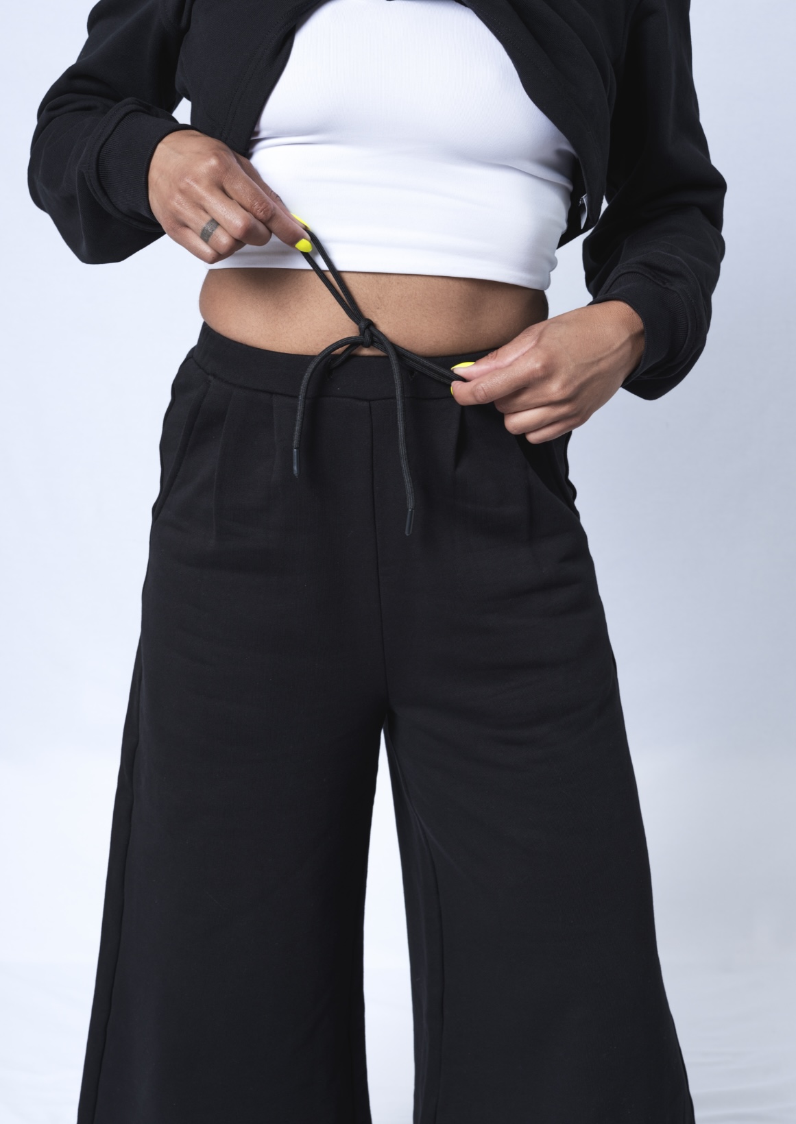 Colette Pants featuring a soft ribbed waistband, deep flat front pockets, and a relaxed fit with a cropped wide leg design, made from heavyweight jersey cotton.