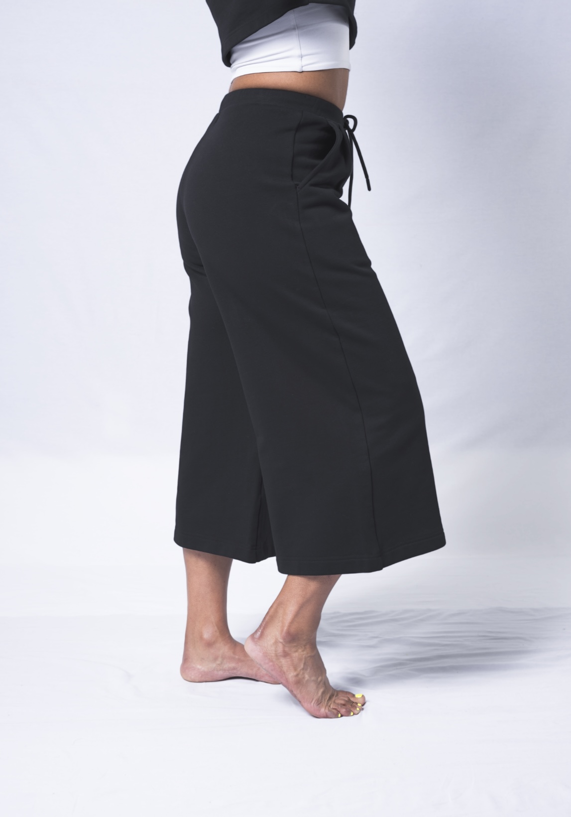 Colette Pants featuring a soft ribbed waistband, deep flat front pockets, and a relaxed fit with a cropped wide leg design, made from heavyweight jersey cotton.