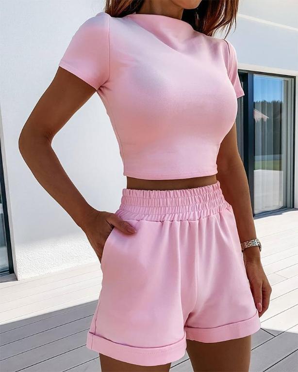 A stylish two-piece women's shorts set featuring a cozy turtleneck top and comfortable shorts, made from a soft cotton and polyester blend in a solid color.