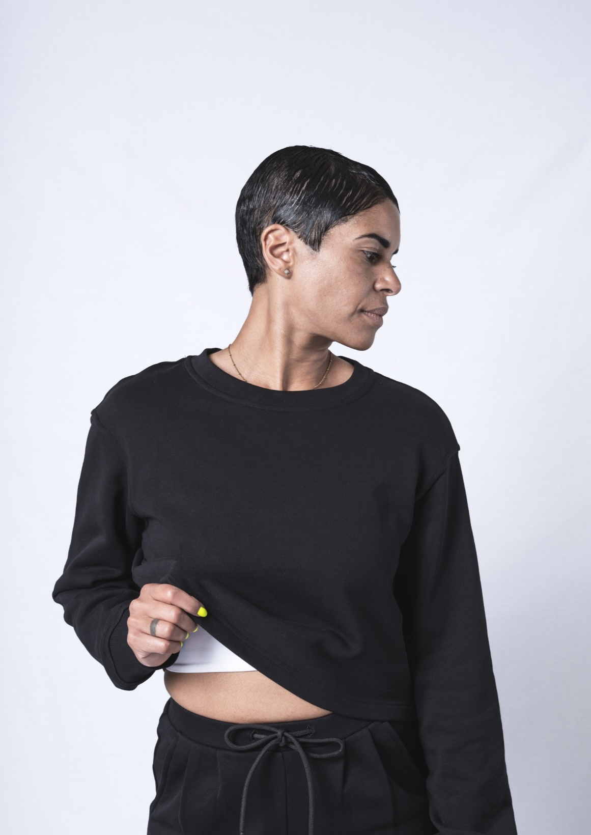 A stylish crew neck sweatshirt in a relaxed fit, made from heavyweight jersey cotton, featuring a drop shoulder design and crop hem, perfect for layering.