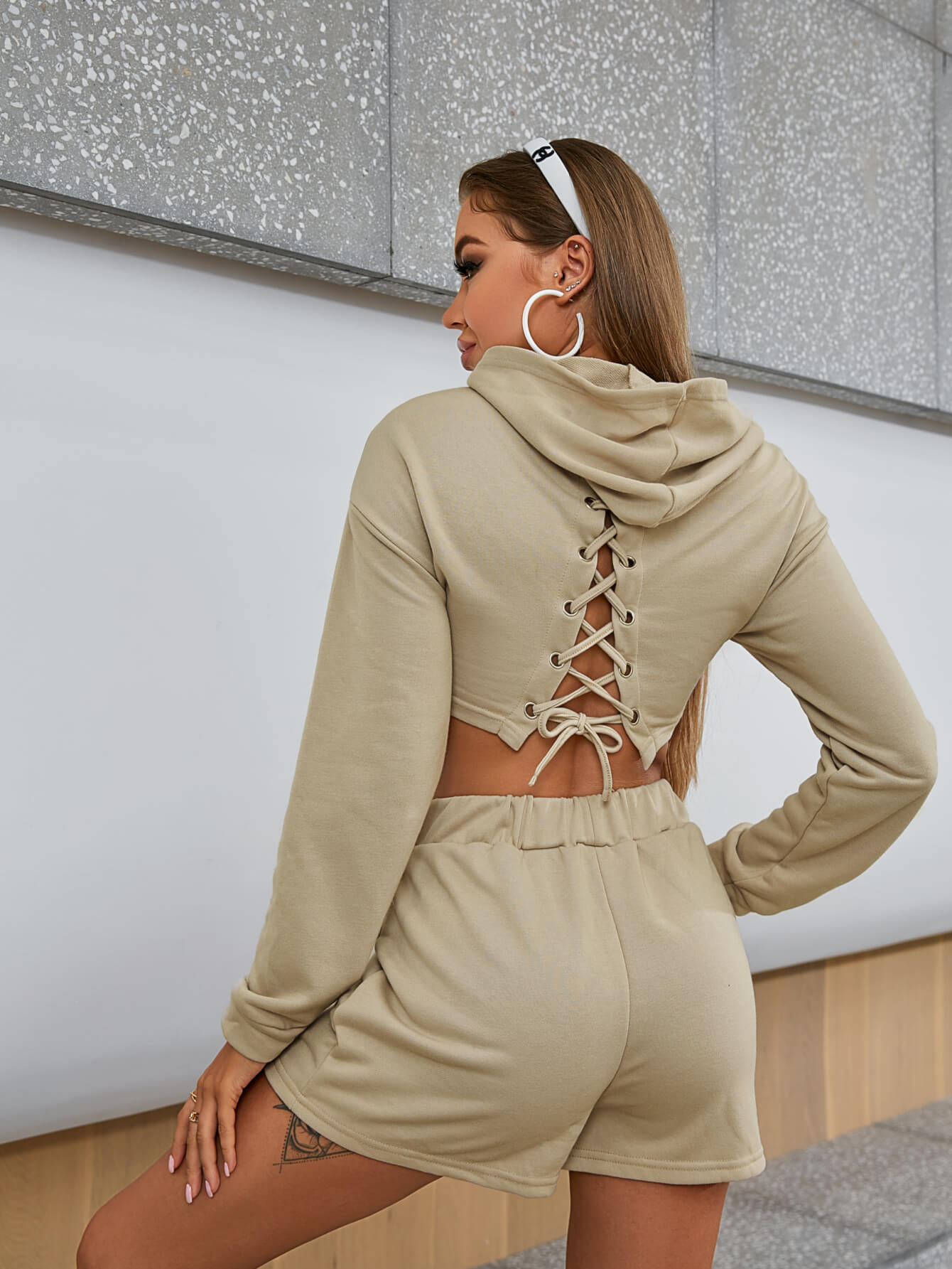 Lace-Up Cropped Hoodie and Shorts Set featuring a stylish lace-up design, hooded neckline, and comfortable fit, made from 100% polyester.