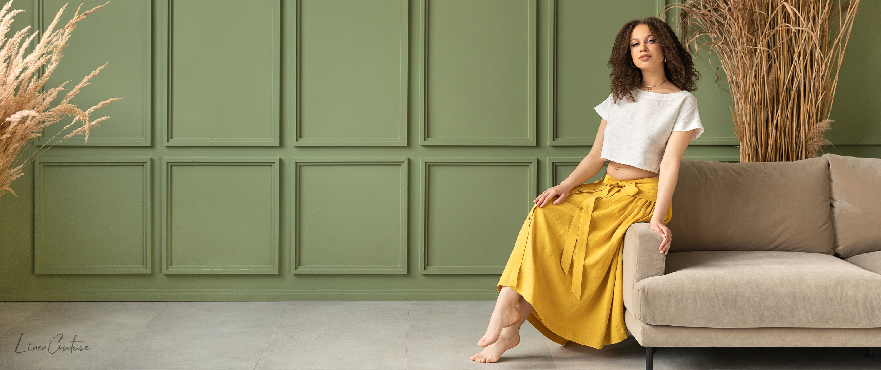 Taormina Honey Linen Crop Top and Midi Skirt Set displayed on a model, showcasing its elegant design and earthy beige color.